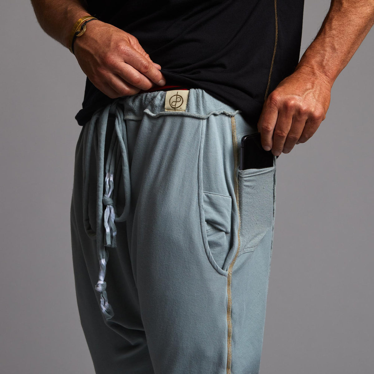 Male modeling Agave colored pants