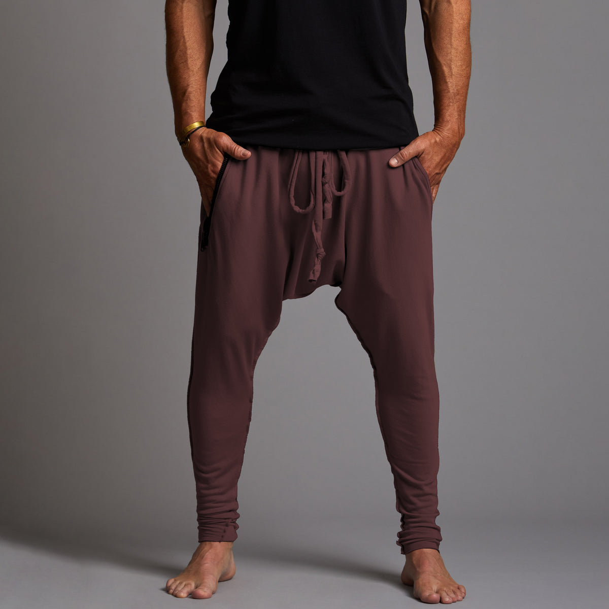 Male modeling tree pants in brazen