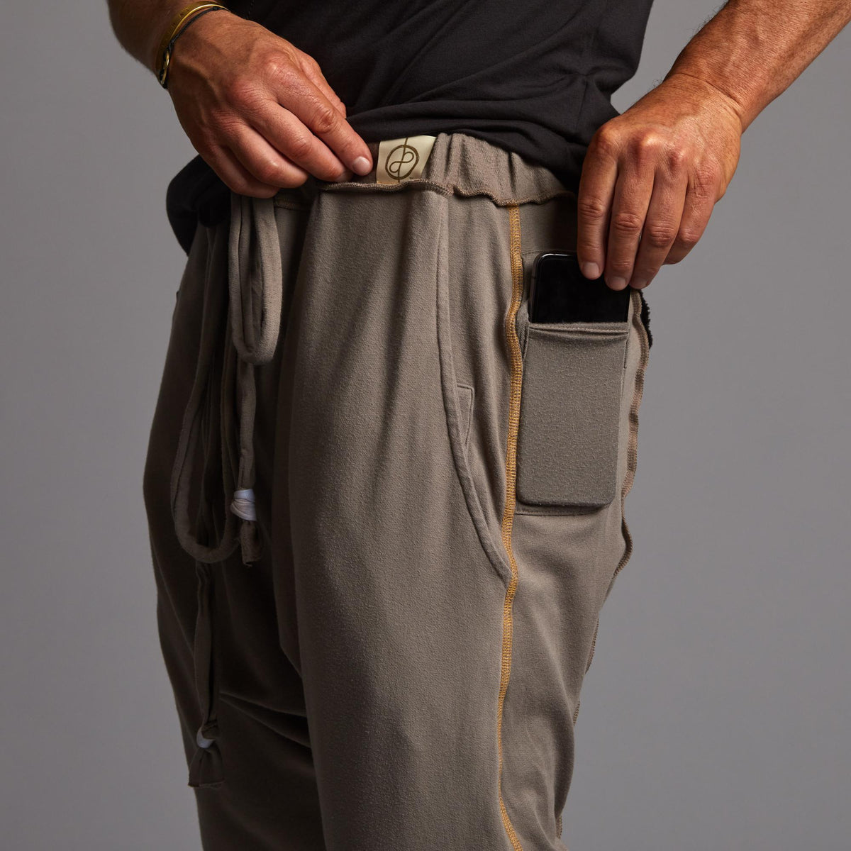 Male modeling Shroom colored pants
