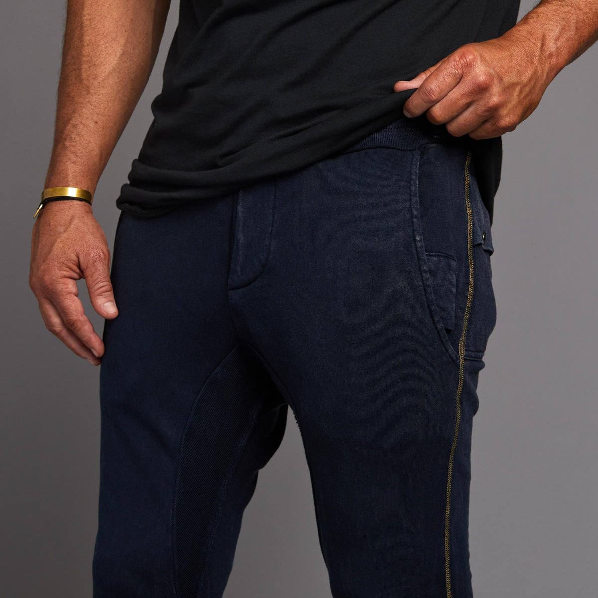 Man modeling the milano pant in blue mineral
