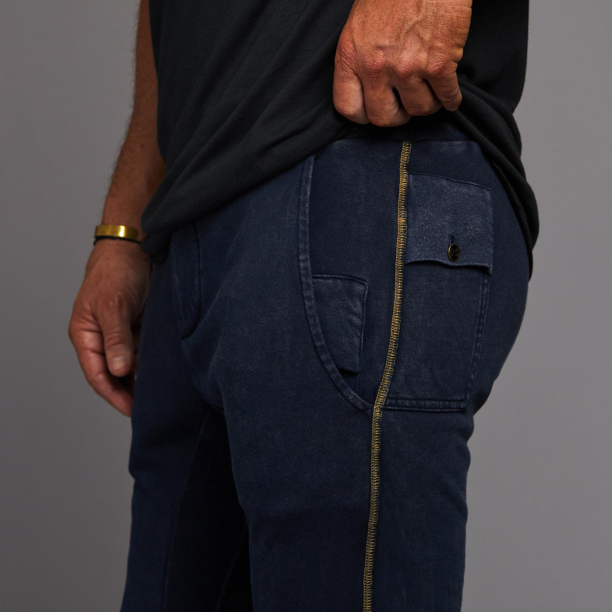 Man modeling the milano pant in blue mineral
