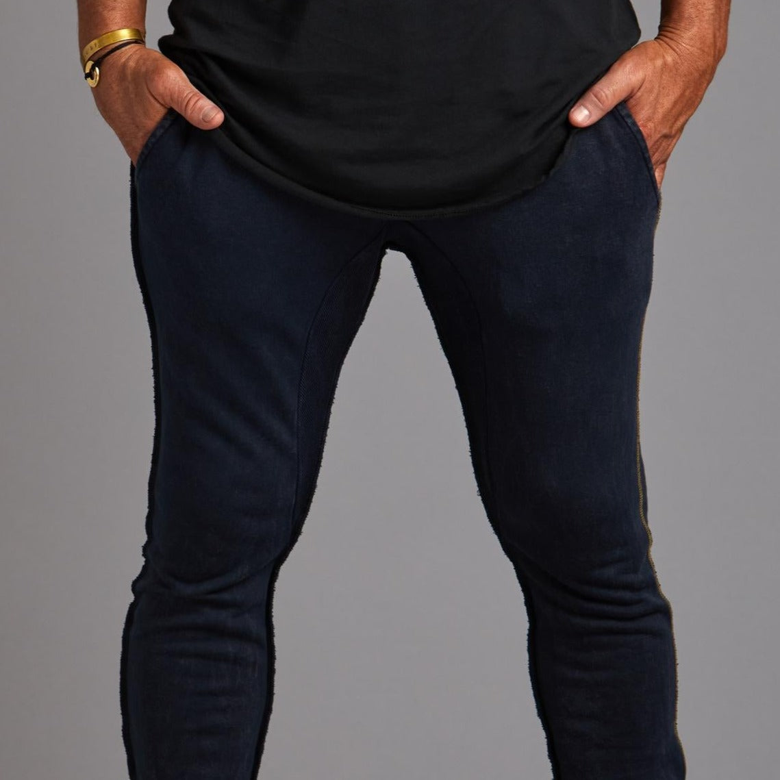 Man modeling the milano pant in blue mineral