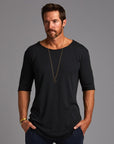Male modeling black crew neck shirt 