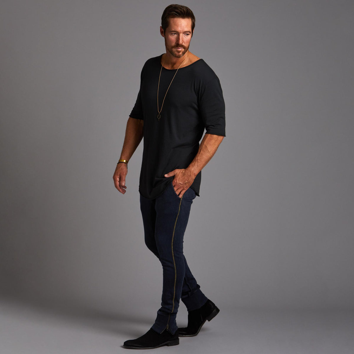 Man modeling the milano pant in charcoal blue