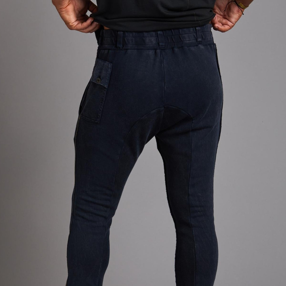 Man modeling the milano pant in blue mineral
