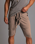 male modeling taupe shorts