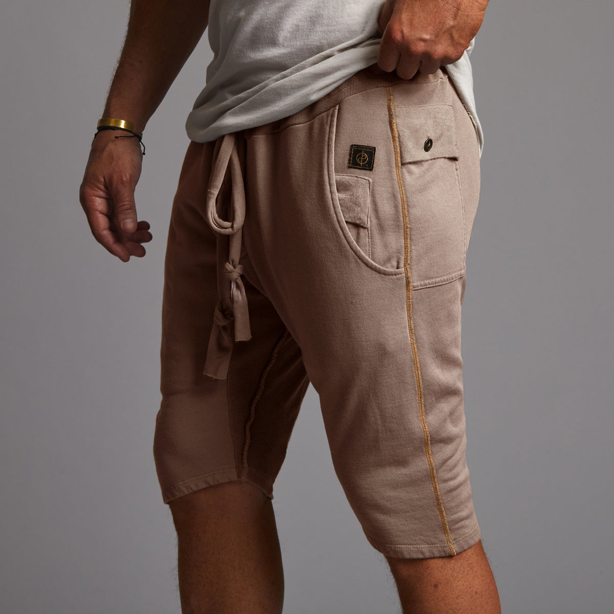 male modeling taupe shorts