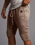 male modeling taupe shorts