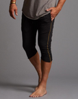 Male modeling black yogo mid shorts