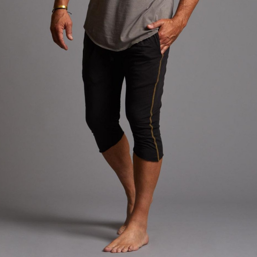 Male modeling black yogo mid shorts