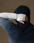 a male modeling the pullover plush hoodie in a blue gradient