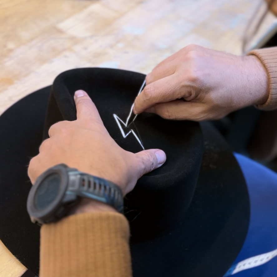 Man tailoring the OGT Bespoke Hat