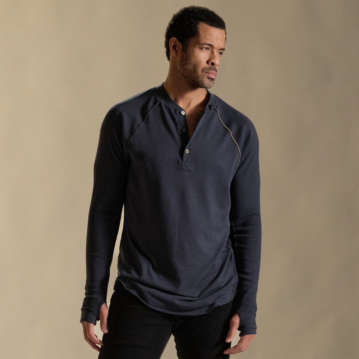 Male modeling blue long sleeve henley