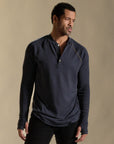 Male modeling blue long sleeve henley