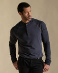 Male modeling blue long sleeve henley