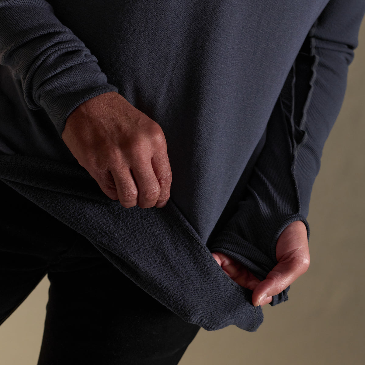 Male modeling blue long sleeve henley