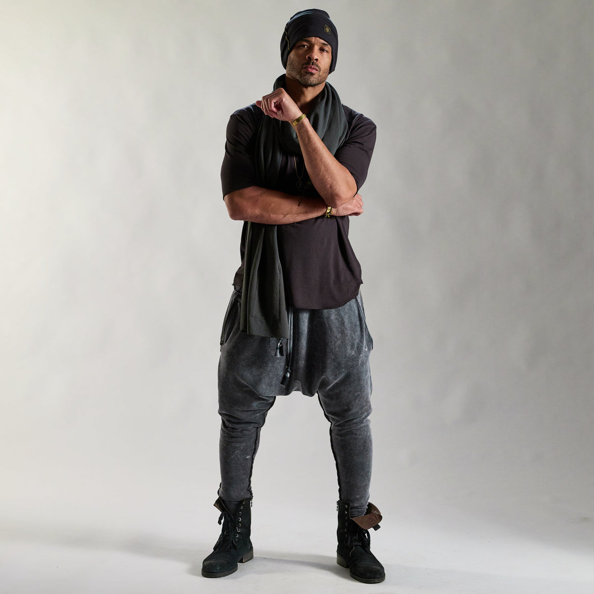 A man modeling tree pant in mineral wash