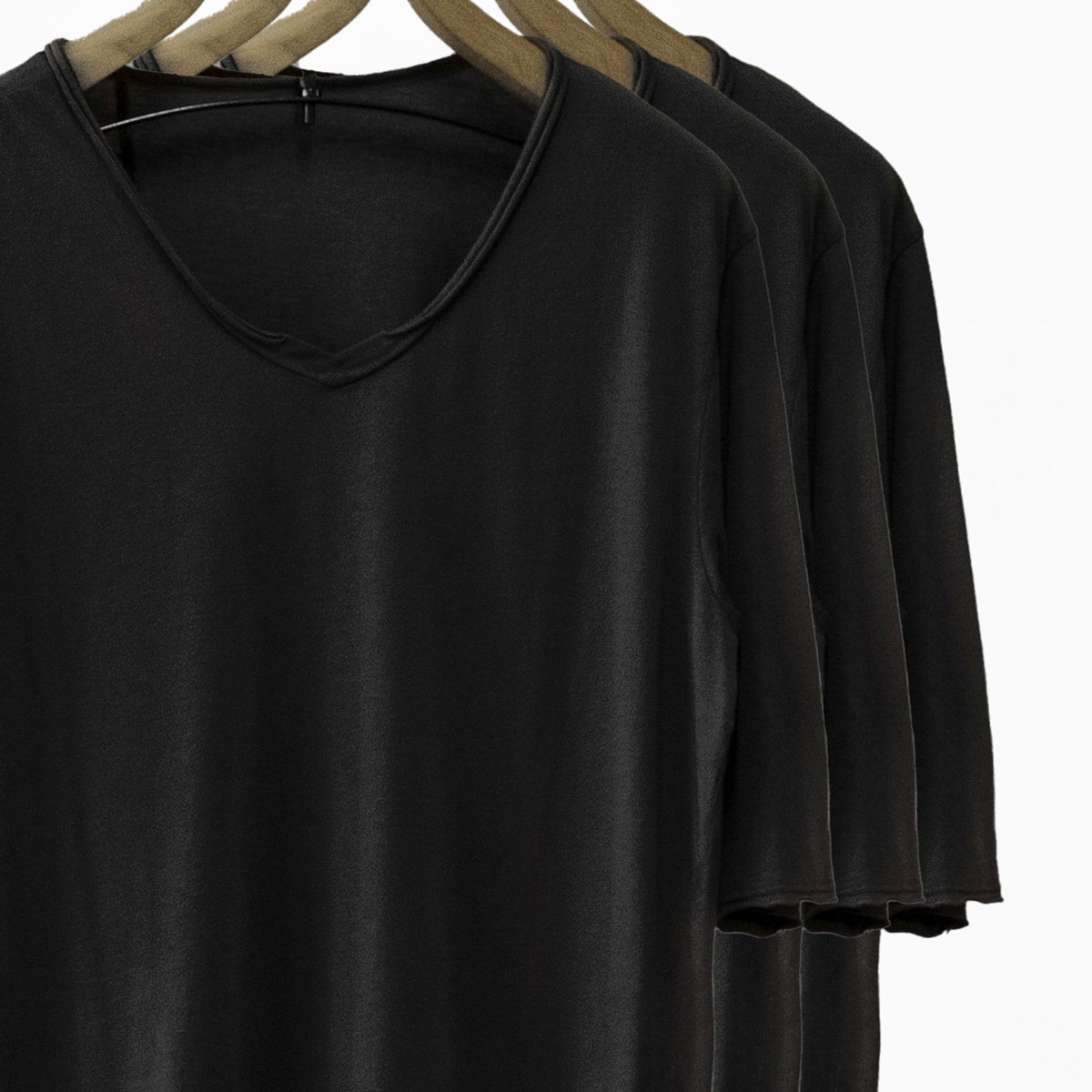 Different colored v neck three pack on clothing racks