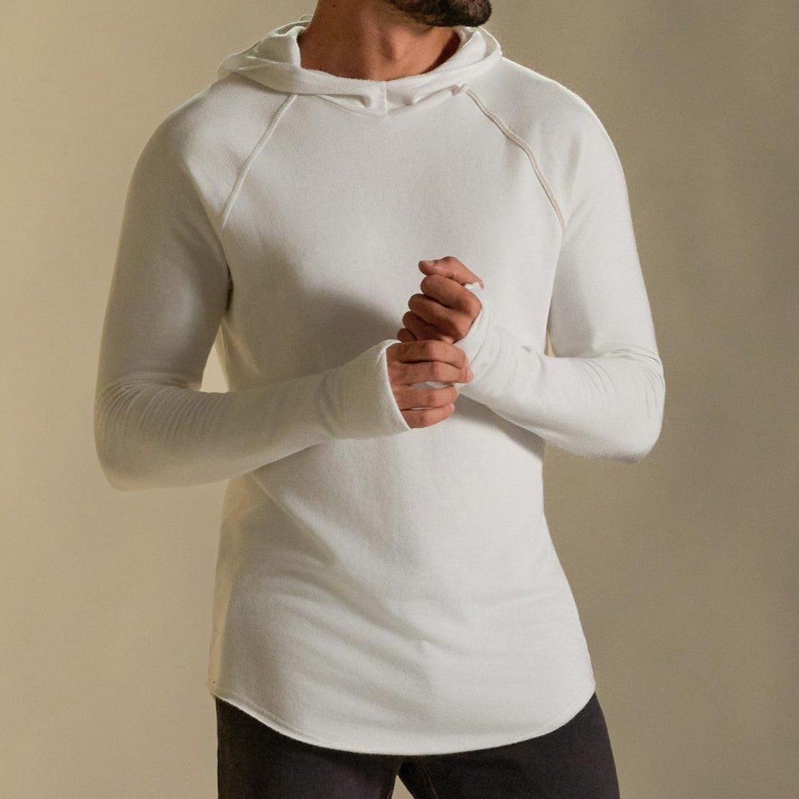 Man modeling white long-sleeve hooded tee