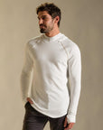 Man modeling white long-sleeve hooded tee