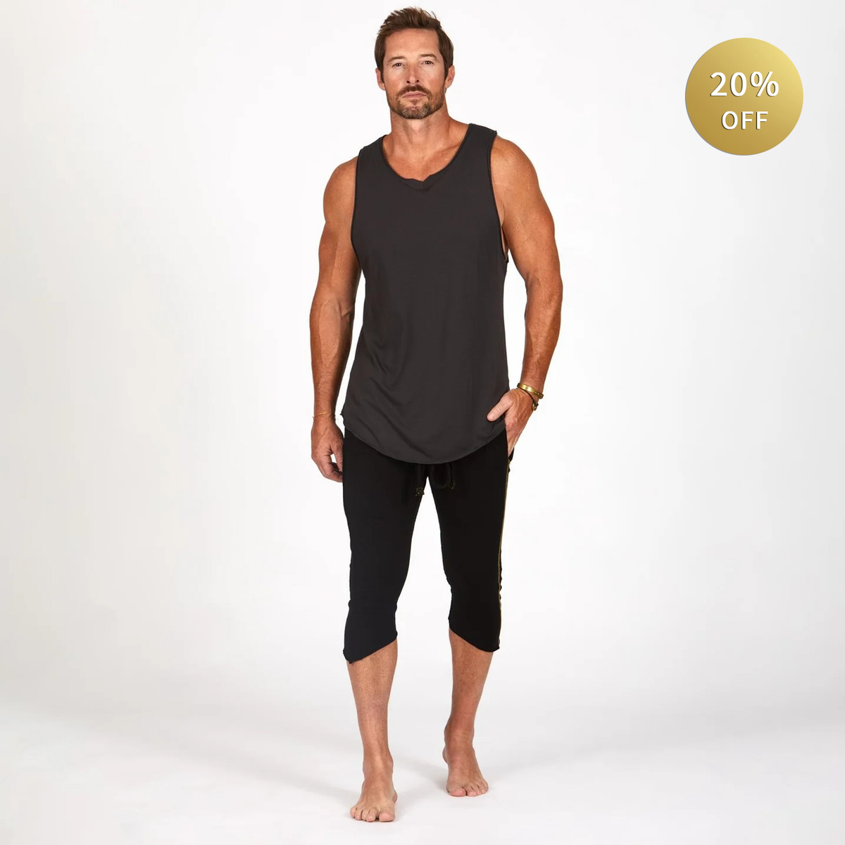 Male modeling black yogo mid shorts