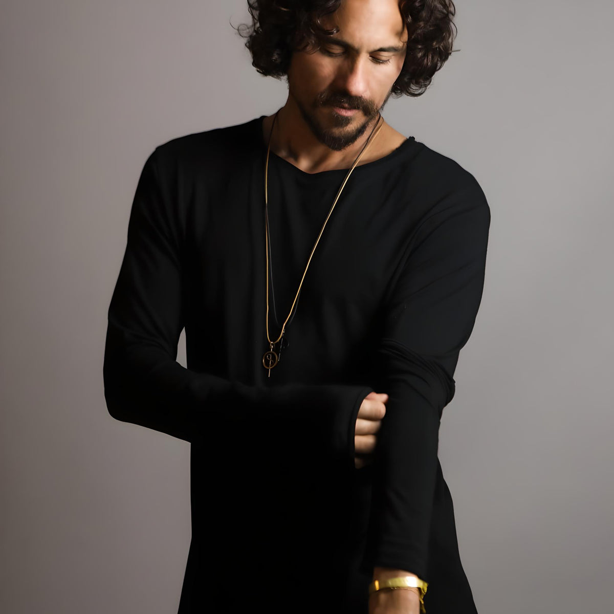 Man modeling a long sleeve crew shirt in black