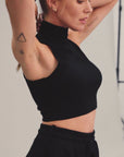 Woman modeling high neck crop in Black