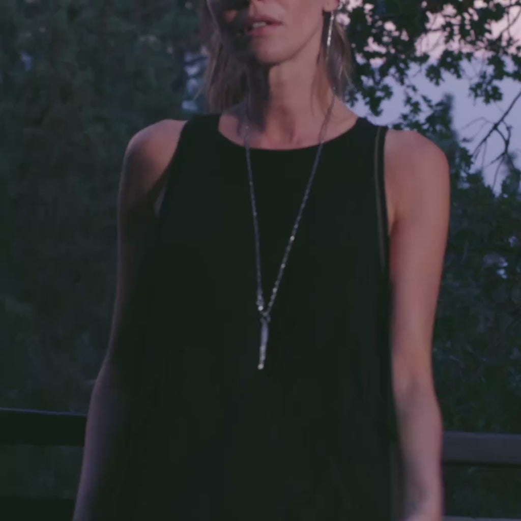 woman modeling the infinite bodysuit in black