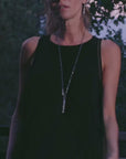 woman modeling the infinite bodysuit in black