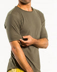 A man wearing the One Golden Thread New Classic Crew t-shirt in Olive color