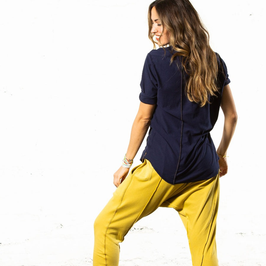 A woman wearing the One Golden Thread New Classic Crew reversible t-shirt in Royal Blue color