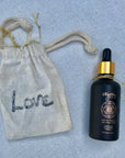 One Golden Thread "7th Sensuous: All Over Essential Oil" with the cotton tote pouch with the message "Love"