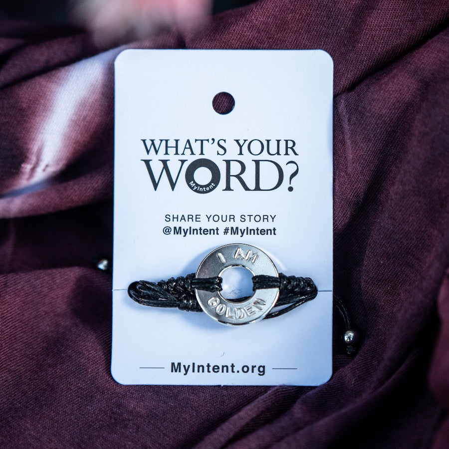 A Customized MyIntent Silver Plated Black Round Bracelet with the words "I Am Golden"