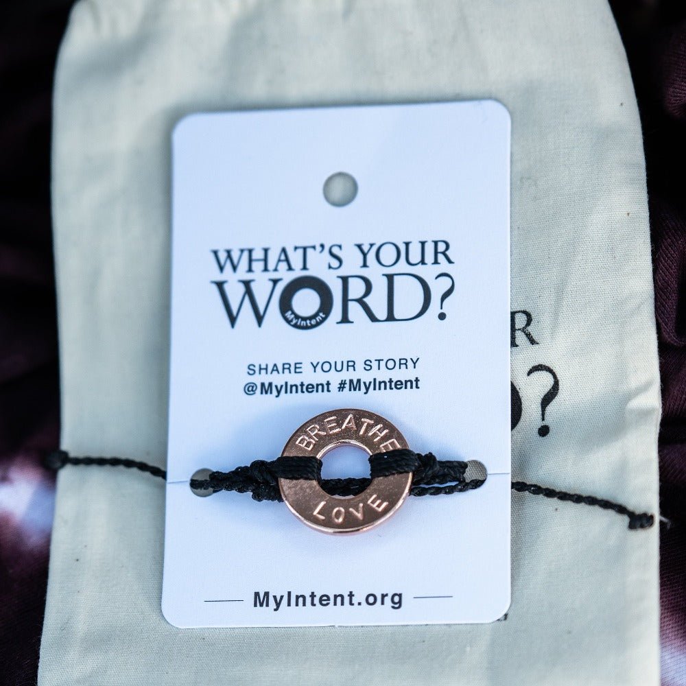 A Customized MyIntent Rose Gold Plated Black Twist Bracelet with the words "Breathe Love"