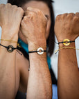 A group of people wearing their Customized MyIntent Black Bracelets with the words "Inner Power" "I Am Golden" and "Inner Peace"