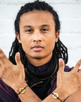 A man wearing two Customized MyIntent Black Twist Bracelets with the words "Breathe" and "Grateful"