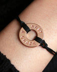 A Customized MyIntent Rose Gold Plated Black Twist Bracelet with the words "Grit & Grace"