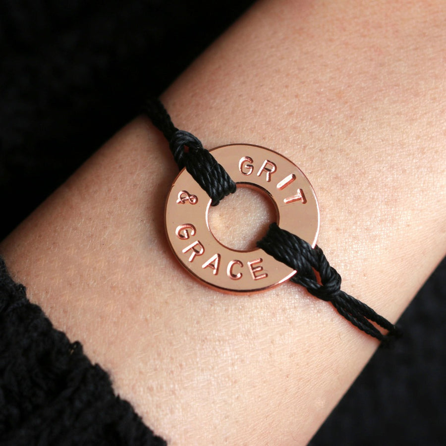 A Customized MyIntent Rose Gold Plated Black Twist Bracelet with the words "Grit & Grace"