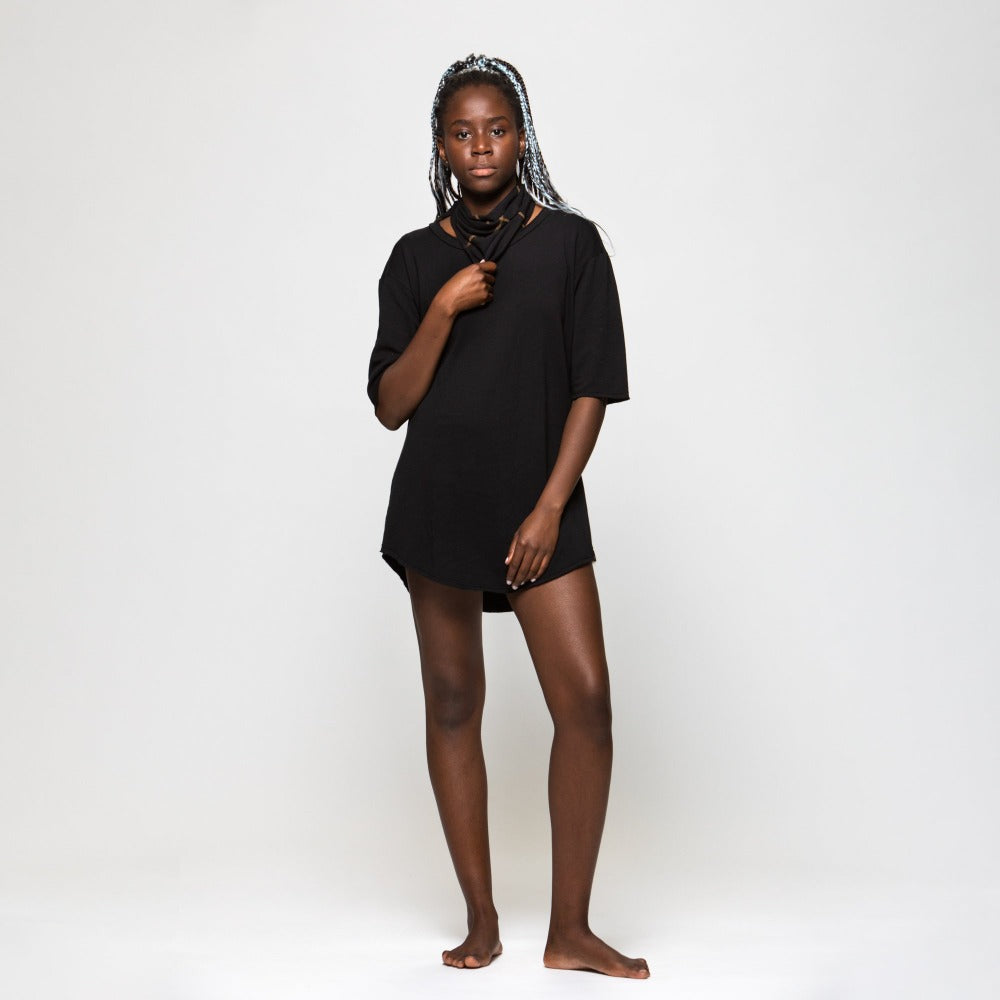 A woman wearing the One Golden Thread Fleece Sweater v neck shirt in the Black Onyx color