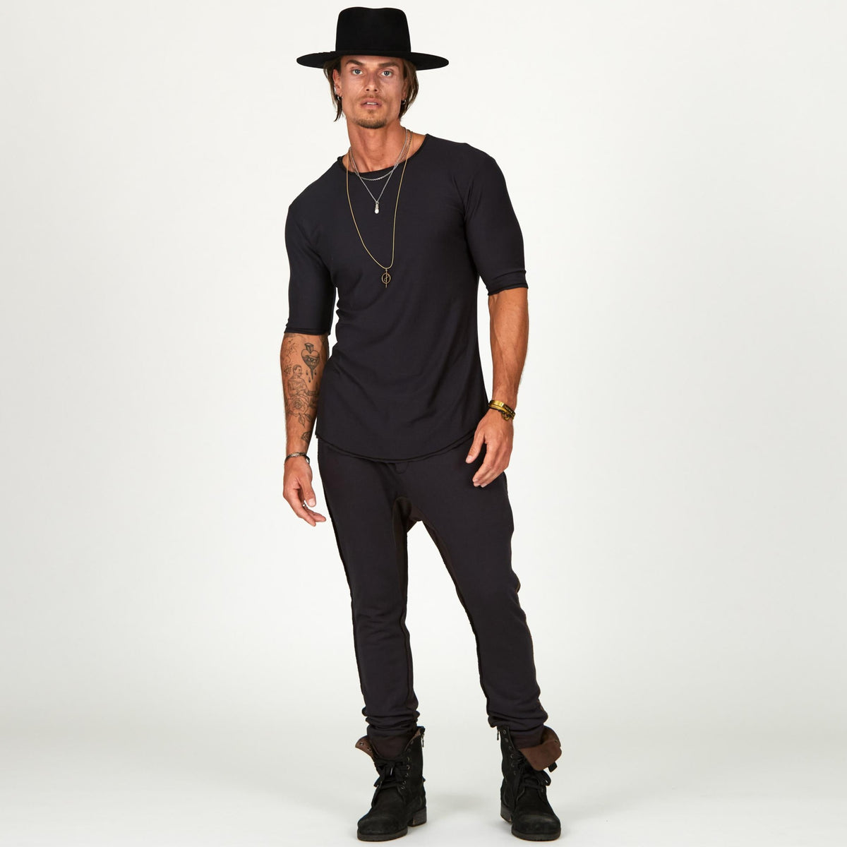 Man modeling a milano pants in charcoal blue