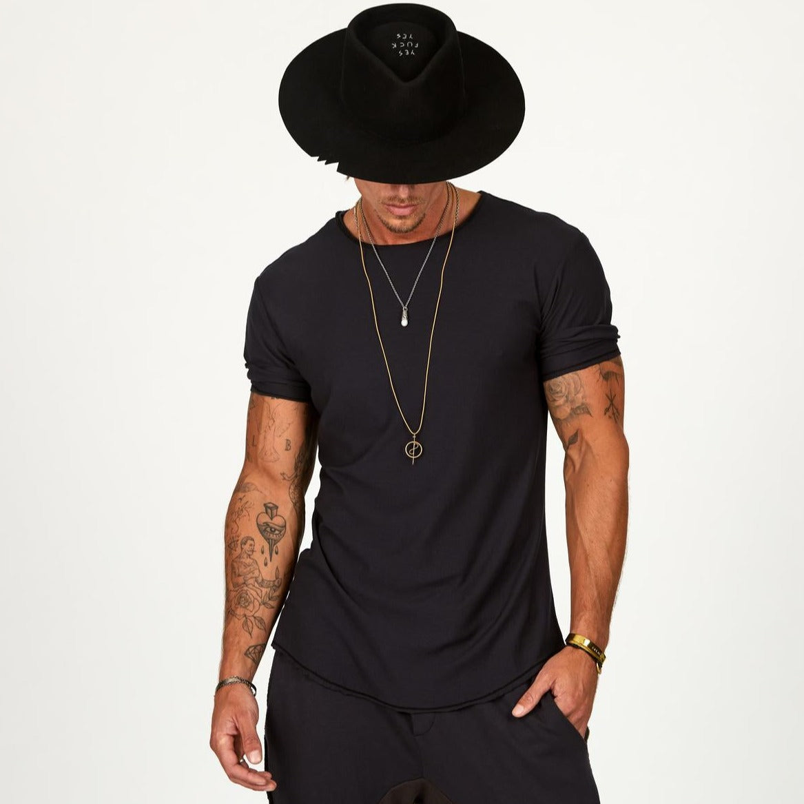 Male modeling black crew neck shirt