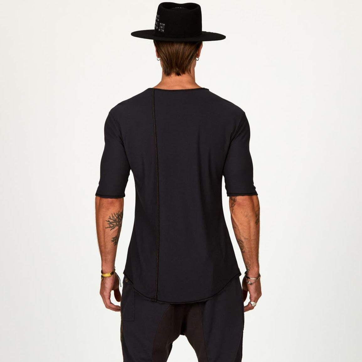 Male modeling black crew neck shirt