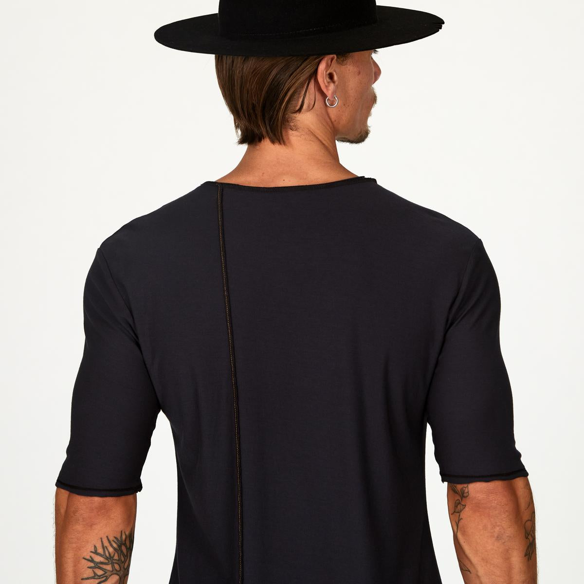 Male modeling black crew neck shirt