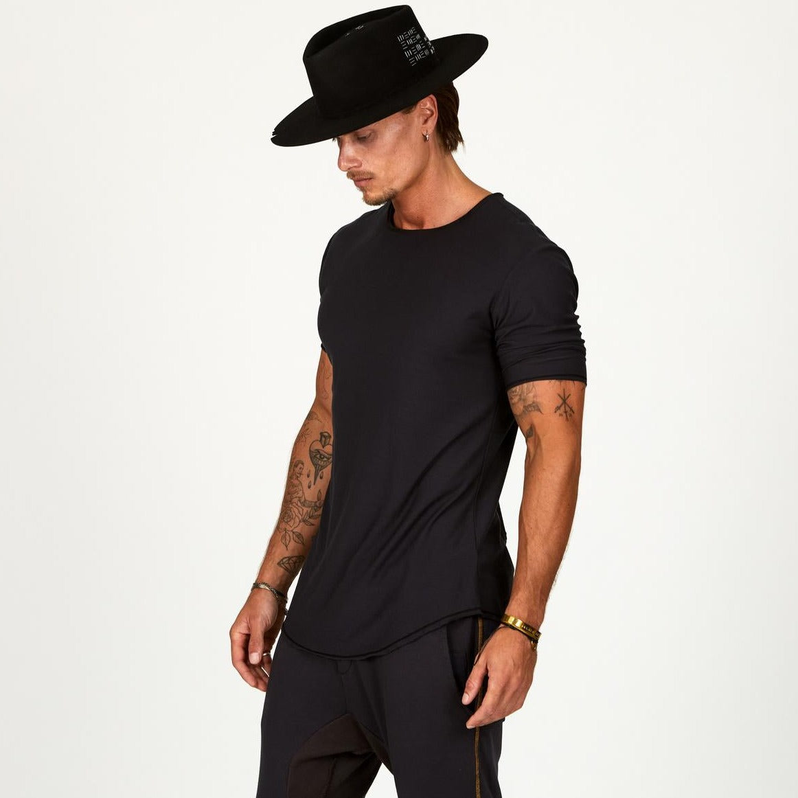 Male modeling black crew neck shirt