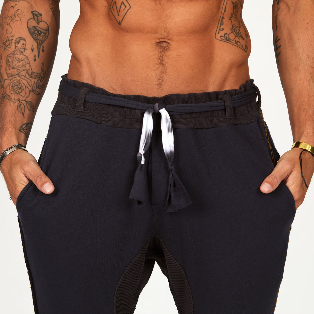 Man modeling the milano pant in charcoal blue