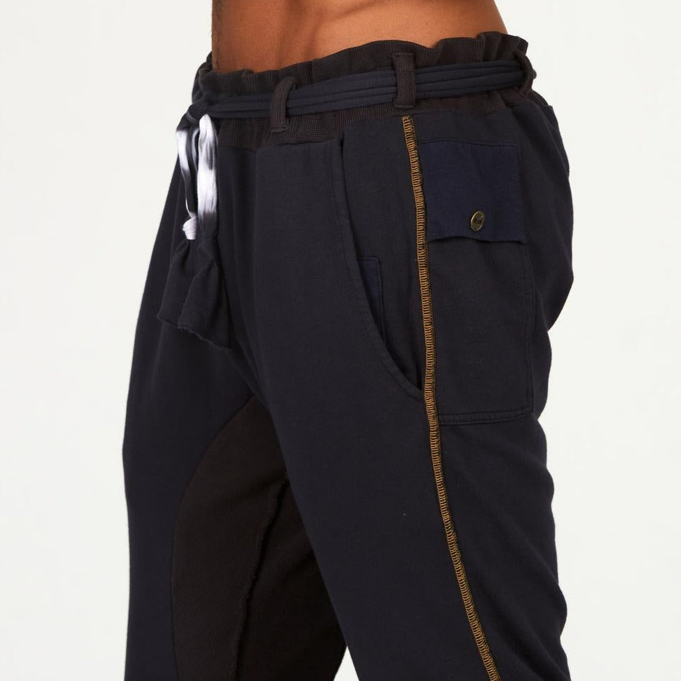 Man modeling a milano pants in charcoal blue