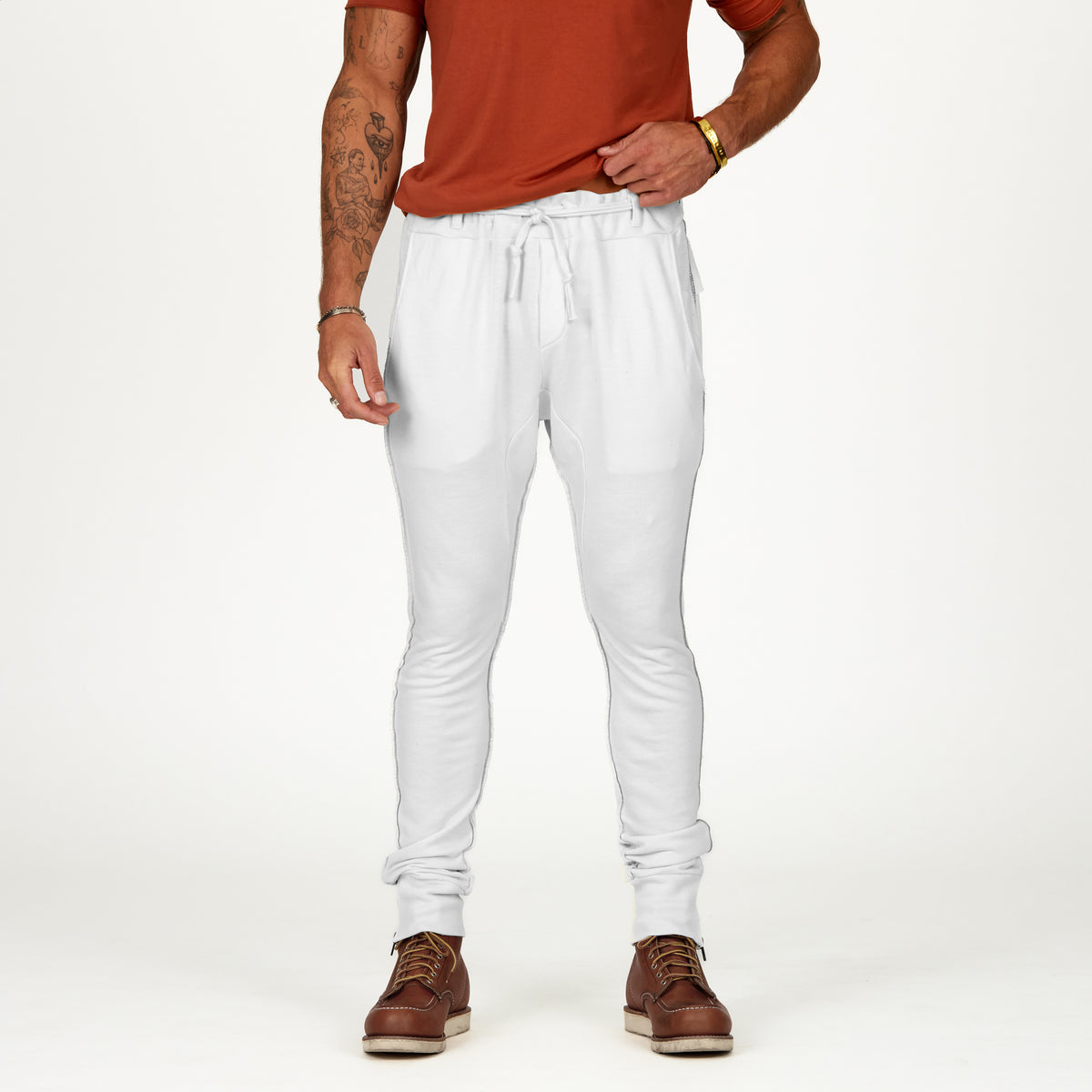 Man modeling the milano pant in pure white