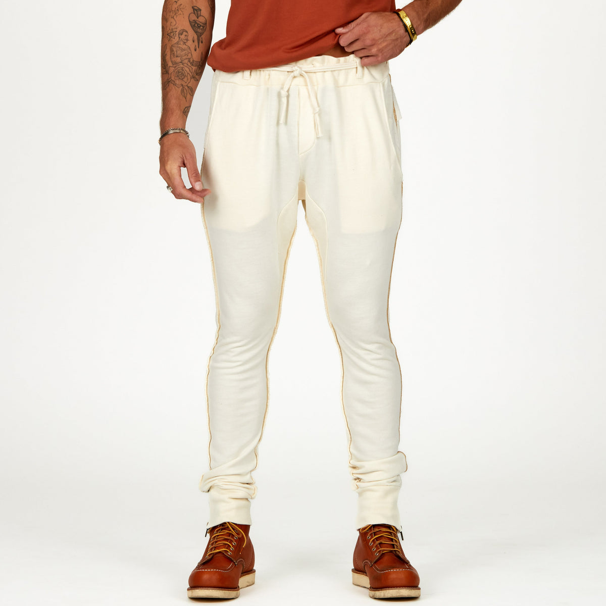 Man modeling the milano pant in white stone