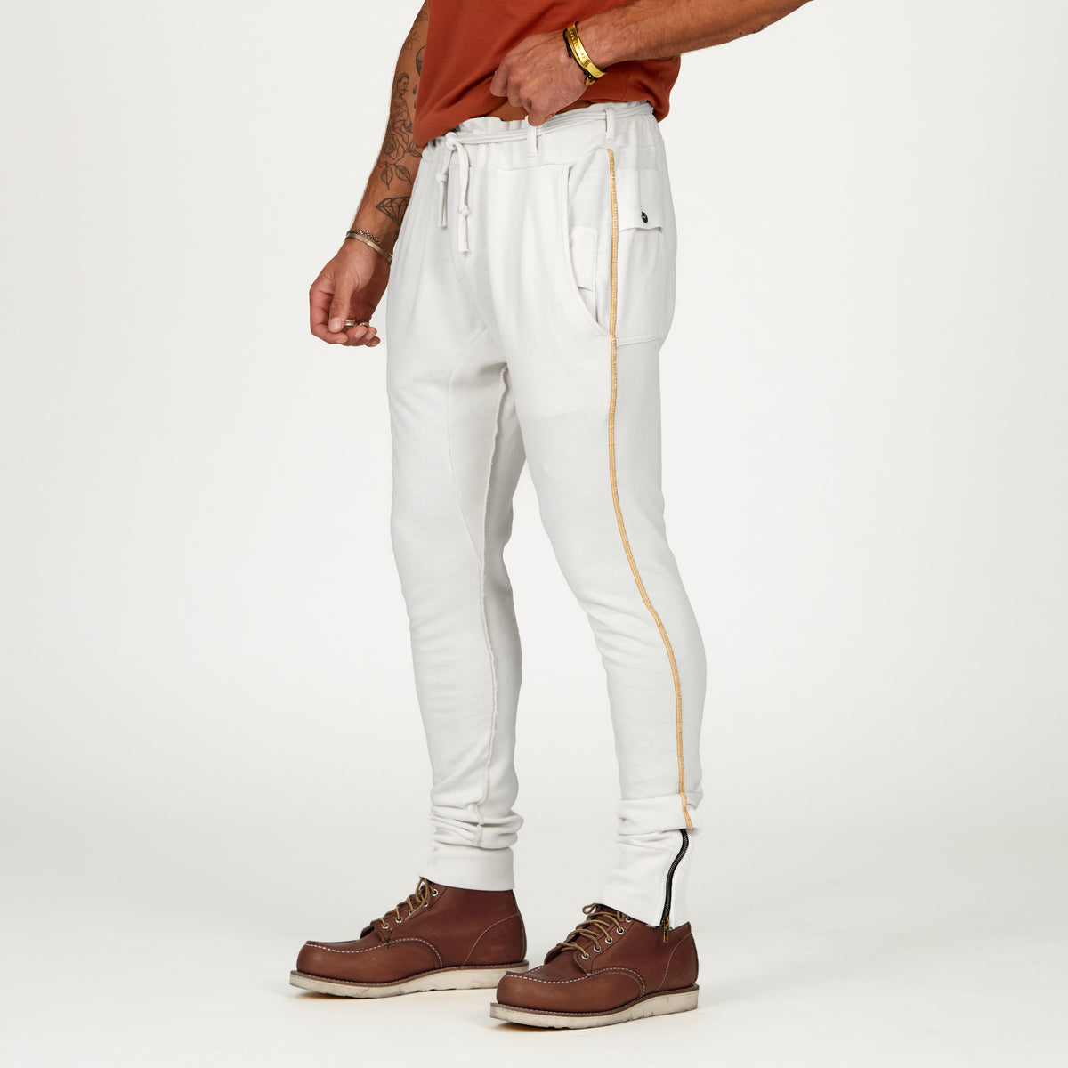 Man modeling the milano pant in pure white