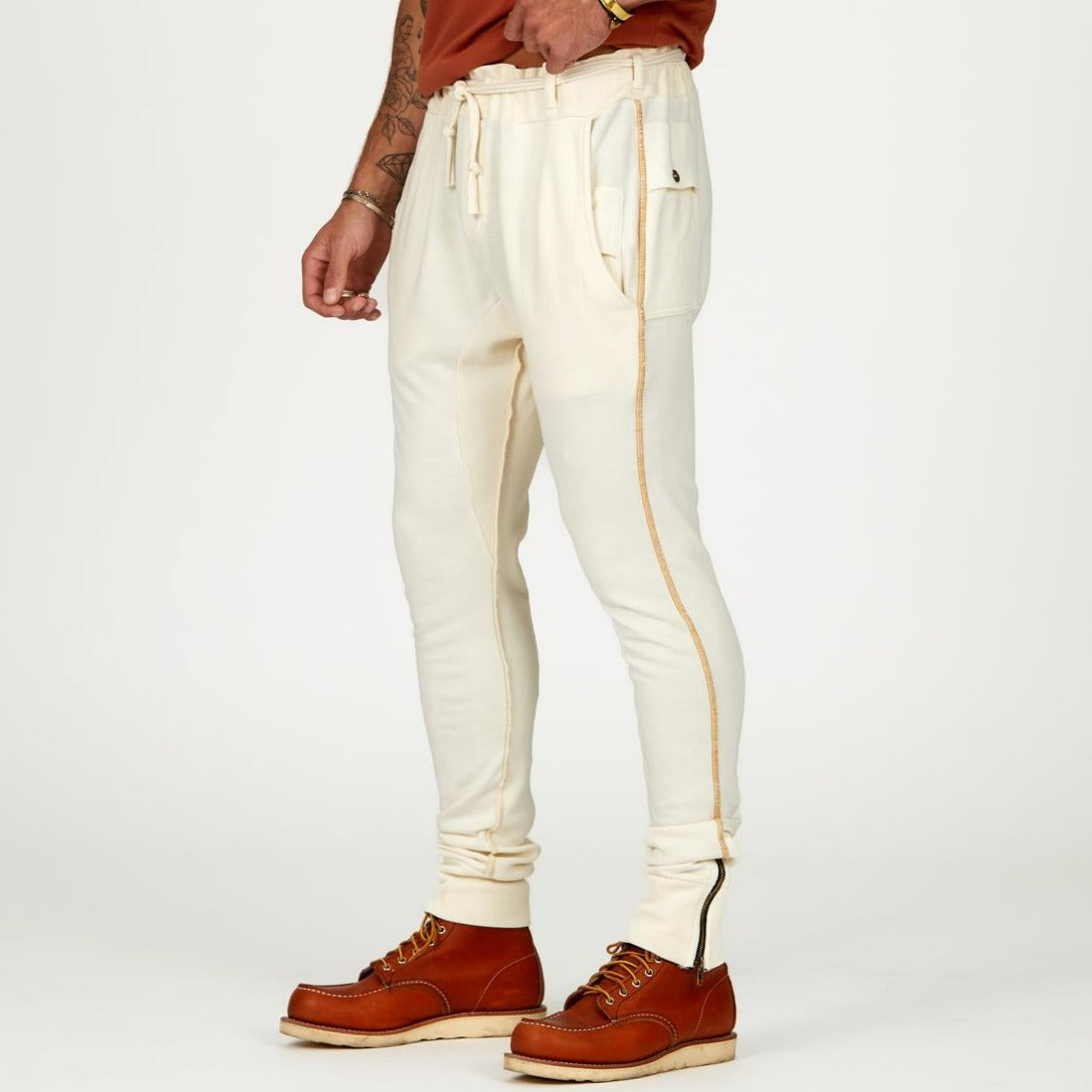 Man modeling the milano pant in white stone